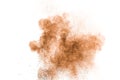 Abstract brown powder splattered on white background.Abstract design of color dust cloud against white background Royalty Free Stock Photo