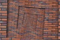 Abstract brown red spiral brick wall pattern background texture. Brown grunge brick wall spiral pattern fractal background brick w Royalty Free Stock Photo