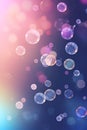 Abstract bubbles background. Realistic transparent colorful soap bubbles with rainbow reflection on a purple colored background. Royalty Free Stock Photo