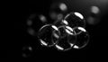 Abstract Bubbles Floating on Black Background with Water Droplets Royalty Free Stock Photo