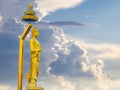 Abstract buddha standing in the dramatic storm clouds. Royalty Free Stock Photo