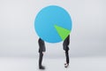 Abstract businessmen with pie chart on head on grey background. Teamwork, success concept