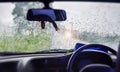 Abstract capture of Natural water drop on the Window glass from inside the Car with condensation during rainy day traveling on Royalty Free Stock Photo