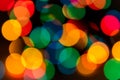 Abstract carnival and Christmas background with colorful bokeh lights of garland, red, green, blue, yellow colors of New Year with Royalty Free Stock Photo