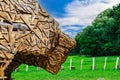 Abstract carved rustic decorative head of a bull or bison. Wood carving is popular hobby in the culture