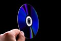 Abstract cd dvd blue-ray disk in hand Royalty Free Stock Photo