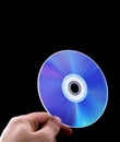 Abstract cd dvd blue-ray disk in hand Royalty Free Stock Photo