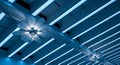 Abstract Ceiling Design with Flower- Shaped Lights and Blue LED Strip Lighting interior Royalty Free Stock Photo