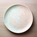 Abstract Ceramic Plate with Delicate Floral Motifs on Oak Table