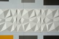 Abstract ceramic wall tiles in the shape of pyramid background
