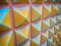Abstract ceramic wall tiles in the shape of pyramid background.