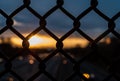 Abstract chain of link fence over highway. Royalty Free Stock Photo