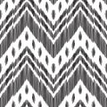 Abstract chevron background. Ikat seamless pattern.