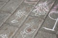 Abstract children picture drew a chalk on asphalt duck, flower and spruce