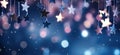 Abstract Christmas background with copy space for product or text. Small pink silver glitter stars on navy blue Royalty Free Stock Photo