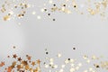 Abstract Christmas background with golden glitter over white board