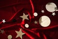 Abstract Christmas background made of red velvet fabric with stars. Royalty Free Stock Photo