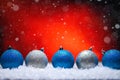 Abstract Christmas background,New Year and Christmas background. Blue and white Christmas toys lie on the snow, with a bright Royalty Free Stock Photo