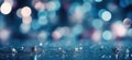Abstract Christmas background. Small silver stars, glitter and bokeh on navy blue background Royalty Free Stock Photo