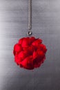 Abstract Christmas bauble and silver metal string on steel background
