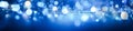 Abstract Christmas blue bokeh background. defocused lights Xmas modern design. For Christmas cards, posters, art texture, Royalty Free Stock Photo