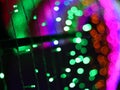 Abstract Christmas Bokeh rainbow blurred background, lightbulb on Christmas tunnel lights for celebrate season with red, green. Royalty Free Stock Photo