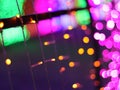 Abstract Christmas Bokeh rainbow blurred background, lightbulb on Christmas tunnel lights for celebrate season with red, green. Royalty Free Stock Photo