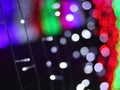 Abstract Christmas Bokeh rainbow blurred background, lightbulb on Christmas tunnel lights for celebrate season with red, green. Royalty Free Stock Photo