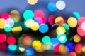 Abstract Christmas and carnival background with colorful bokeh lights of garland, red, green, blue, yellow colors of New Year with Royalty Free Stock Photo