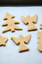 Abstract Christmas food background with cookies molds and flour. Baking Christmas cookies - table, cookie cutters and cookies. Royalty Free Stock Photo