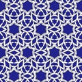 Abstract festive Christmas snowflake pattern on blue background