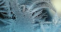 Abstract Christmas horizontal stories. Ice crystals on frozen window glass. Frost drawing. Dark blue tinted illustration Royalty Free Stock Photo