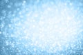 Abstract Christmas and New Years winter blue background with bokeh snowflakes Royalty Free Stock Photo