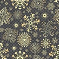 Abstract Christmas seamless pattern with golden snowflakes Royalty Free Stock Photo