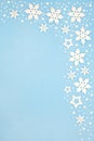Abstract Christmas Snowflake Background Border on Pastel Blue Royalty Free Stock Photo
