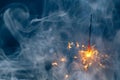 Abstract Christmas sparkler firework copy-space background with smoke Royalty Free Stock Photo