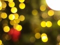 abstract christmas tree bokeh blur light circle red yellow and white glowing flare pattern black background Royalty Free Stock Photo