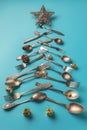 Abstract Christmas tree made from blue background. Top view . tree of knives and forks with a star Royalty Free Stock Photo