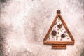 Abstract Christmas tree made from spices. Christmas tree made of cinnamon sticks, star anise, cardamom and red peppercorns. Beige Royalty Free Stock Photo