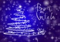 Abstract Christmas tree on shiny blue background with the writing 