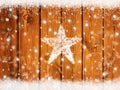 Christmas winter background with snowflakes on wooden board and star from snow Royalty Free Stock Photo