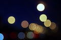 City lights abstract circular bokeh on a blue background.