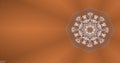 Abstract circular cluster of particles performing different kaleidoscopic patterns over brown background.