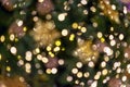 Abstract circular light bokeh, New Year and Christmas festive background of defocused decorated tree garlands Royalty Free Stock Photo