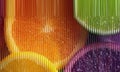 Abstract Citrus Fruit Background with Orange and Lime Slices Behind Vertical Reeded Glass Texture Royalty Free Stock Photo
