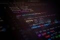 Abstract close-up of colorful programming code on dark screen, representing software development, digital logic, data processing, Royalty Free Stock Photo
