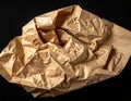 Abstract Texture of Crumpled Brown Kraft Paper with Dramatic Lighting brown paper Royalty Free Stock Photo