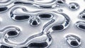 Abstract close-up of metallic liquid flowing and forming droplets Royalty Free Stock Photo