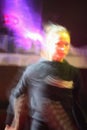 Abstract close up motion blur colourful image of happy dancing people in a disco night club. Royalty Free Stock Photo