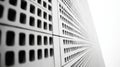 Abstract close-up of a perforated surface with geometric square patterns, creating a striking monochromatic design with